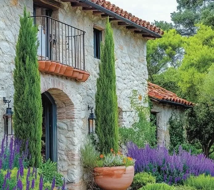 Mediterranean villa courtyard shaded by olive trees
